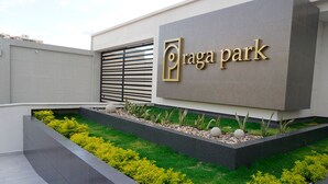 A modern building with a sign reading "Traga Park".