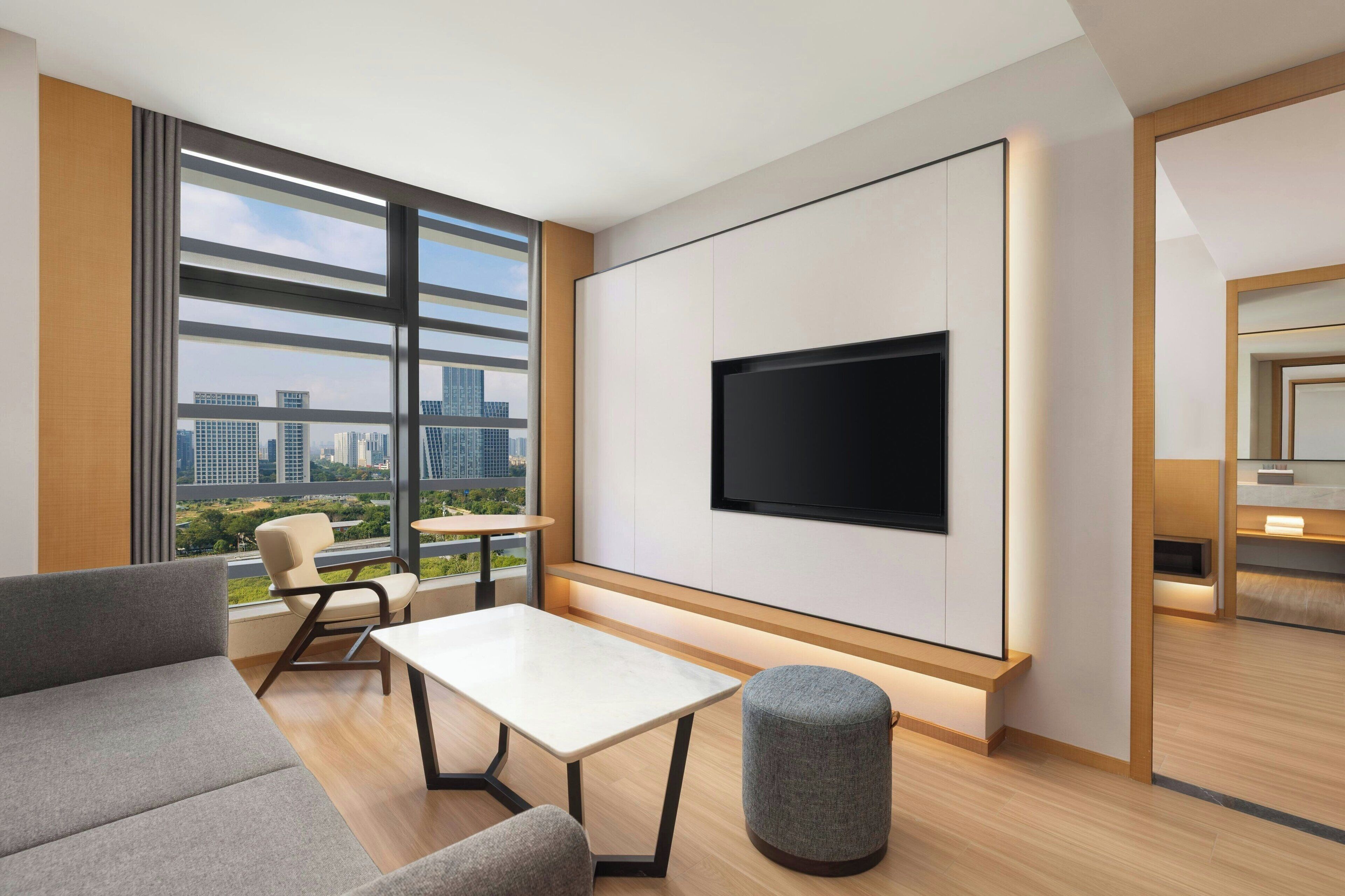 Junior Suite, 1 King Bed, City View | Living room | TV