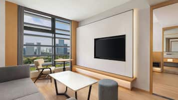Junior Suite, 1 King Bed, City View | Living room | TV