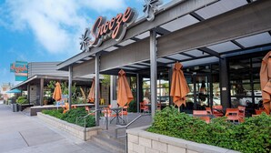 A restaurant named "Snooze" with outdoor seating and a covered patio area. - Downtown Gilbert • Hot Tub • Glow Golf • Sleeps 12 (Gilbert)