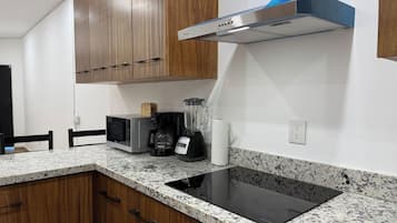 Fridge, microwave, stovetop, coffee/tea maker