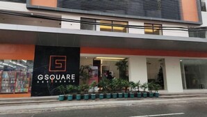 A modern building with a prominent 'GSQUARE RESIDENCE' sign. - G Square Residences (Manila)
