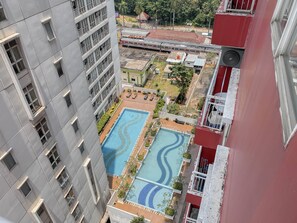 Outdoor pool - Nice & Cozy Studio Apartment At Taman Melati Margonda (Depok)