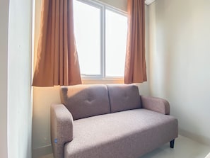 Standard Studio | Living area - Neutral Minimalist Studio Apartment At Lrt City Sentul - Royal Sentul Park (Bogor)