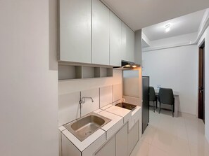 Standard Apartment | Private kitchen - Combined Grey Toned 2Br Apartment At The City Square Surabaya (Surabaya)