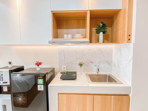 Standard Studio | Private kitchen - Simple Compact Studio At Apartment Pollux Chadstone (Cikarang)