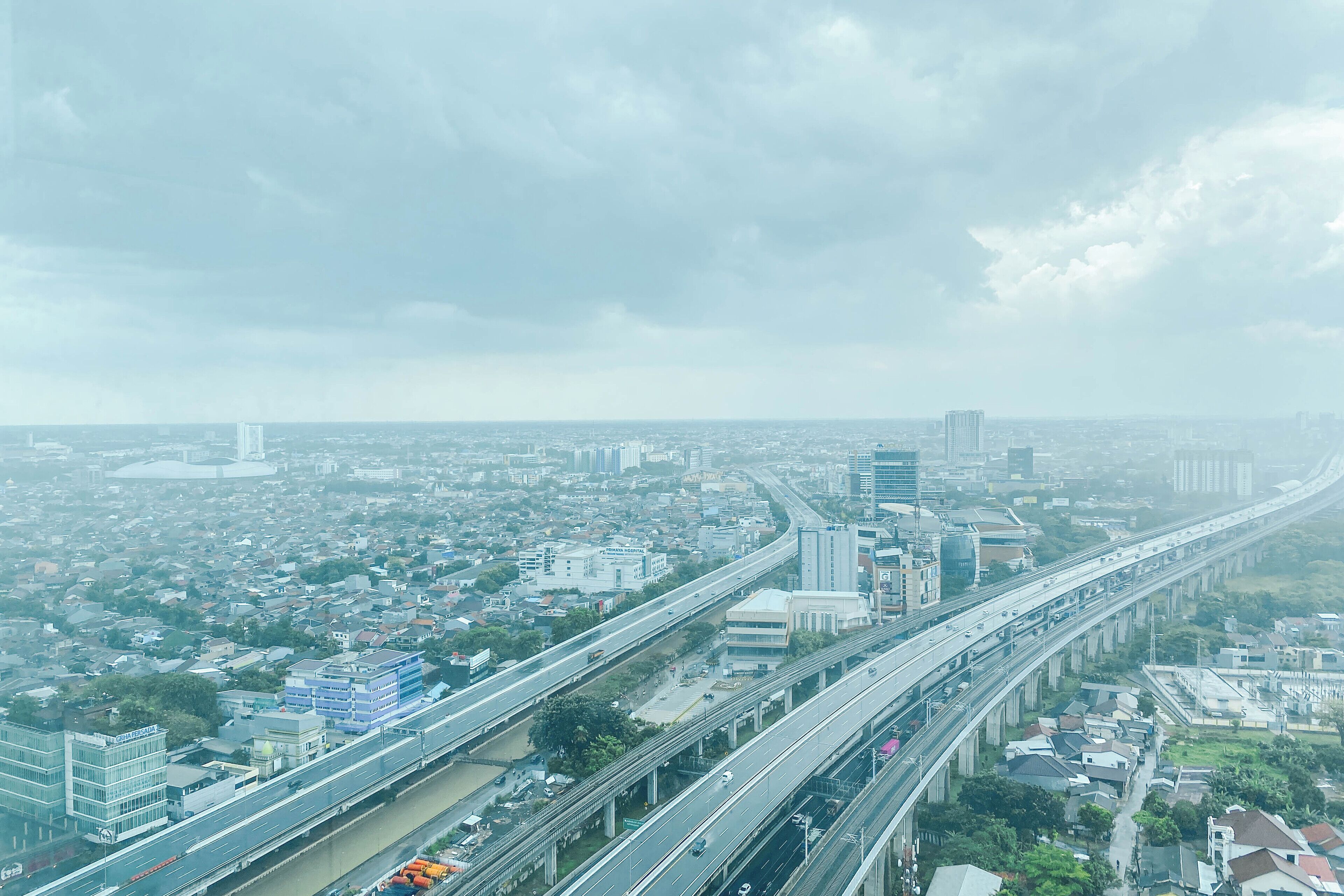 A cityscape with multiple highways and buildings.