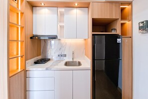 Standard Studio | Private kitchen - Wooden Tone Studio At Casa De Parco Apartment (Pagedangan)