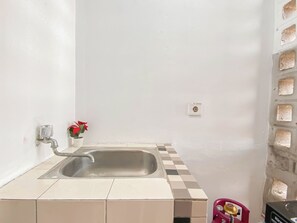 Standard Studio | Private kitchen | Fridge - Basic Studio Apartment At Margonda Residence 1 (Depok)