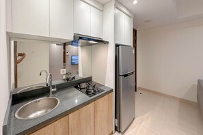 Standard Apartment | Private kitchen - Cozy And Homey 2Br At Grand Sungkono Lagoon Apartment (Surabaya)