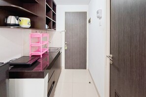 Standard Apartment | Private kitchen - Basic Studio Near Cisauk Station At Serpong Garden Apartment (Cisauk)