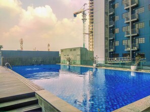 Outdoor pool - Cream Tone Studio At Evenciio Margonda Apartment (Depok)