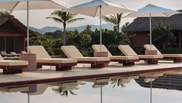 Outdoor pool, pool umbrellas, sun loungers