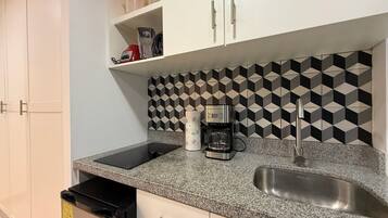 Microwave, stovetop, coffee/tea maker, toaster