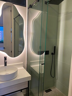 Shower, hair dryer, towels, soap