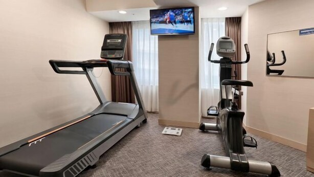 A hotel room with a treadmill, elliptical, and stationary bike. - Holiday Inn Express TAOYUAN by IHG (Taoyuan)