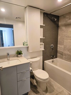 Shower, hair dryer, towels, soap