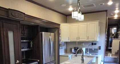 Escape to a luxury 1BR/1BA 5th wheel. Full indoor/outdoor kitchen, & LOTS more!