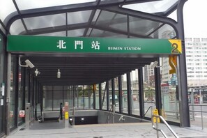 A bus station entrance with a green sign indicating it is the Beimen Station. - Ximen Relite Hotel (Taipei)