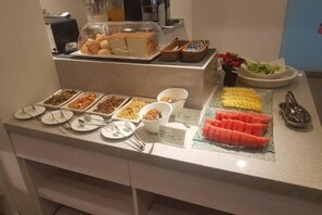 A buffet with various food items and utensils. - Only Love Motel (New Taipei City)
