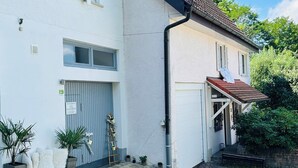 A two-story building with a grey door and a red tiled roof. - AlbGlück 2, Hechingen, 1–7 people, castle 5 km away (Hechingen)