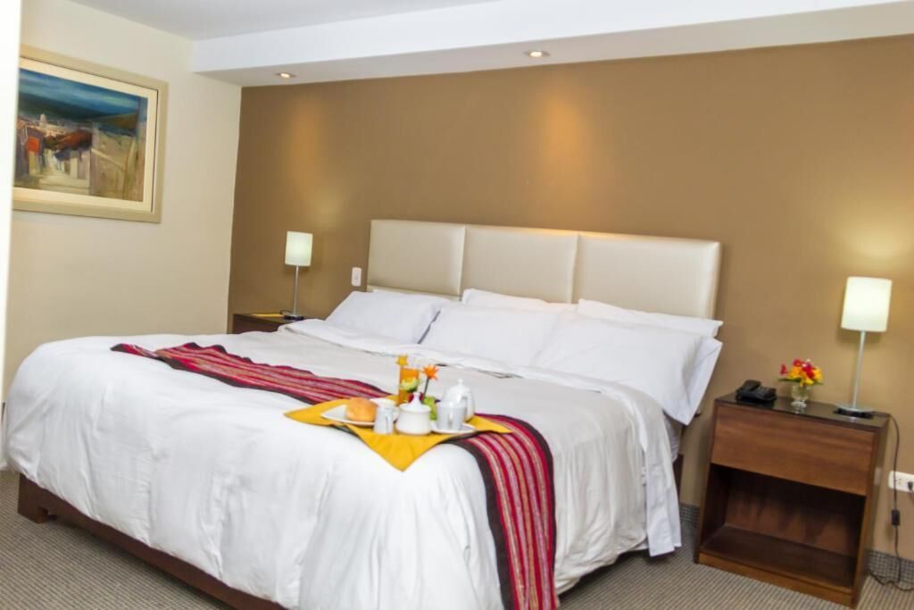 Suite, Balcony, Courtyard View | Desk, laptop workspace, iron/ironing board, free WiFi