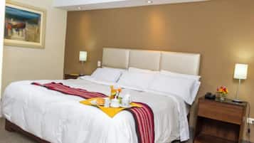 Suite, Balcony, Courtyard View | Desk, laptop workspace, iron/ironing board, free WiFi