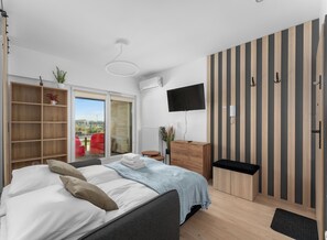 1 slaapkamer, een strijkplank/strijkijzer, wifi, beddengoed