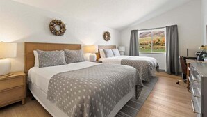 A hotel room with two beds, a desk, and a view of the outdoors. - Updated Villa w/ Resort Amenities + Holistic Body Services Villa 3021-Q (Midway)