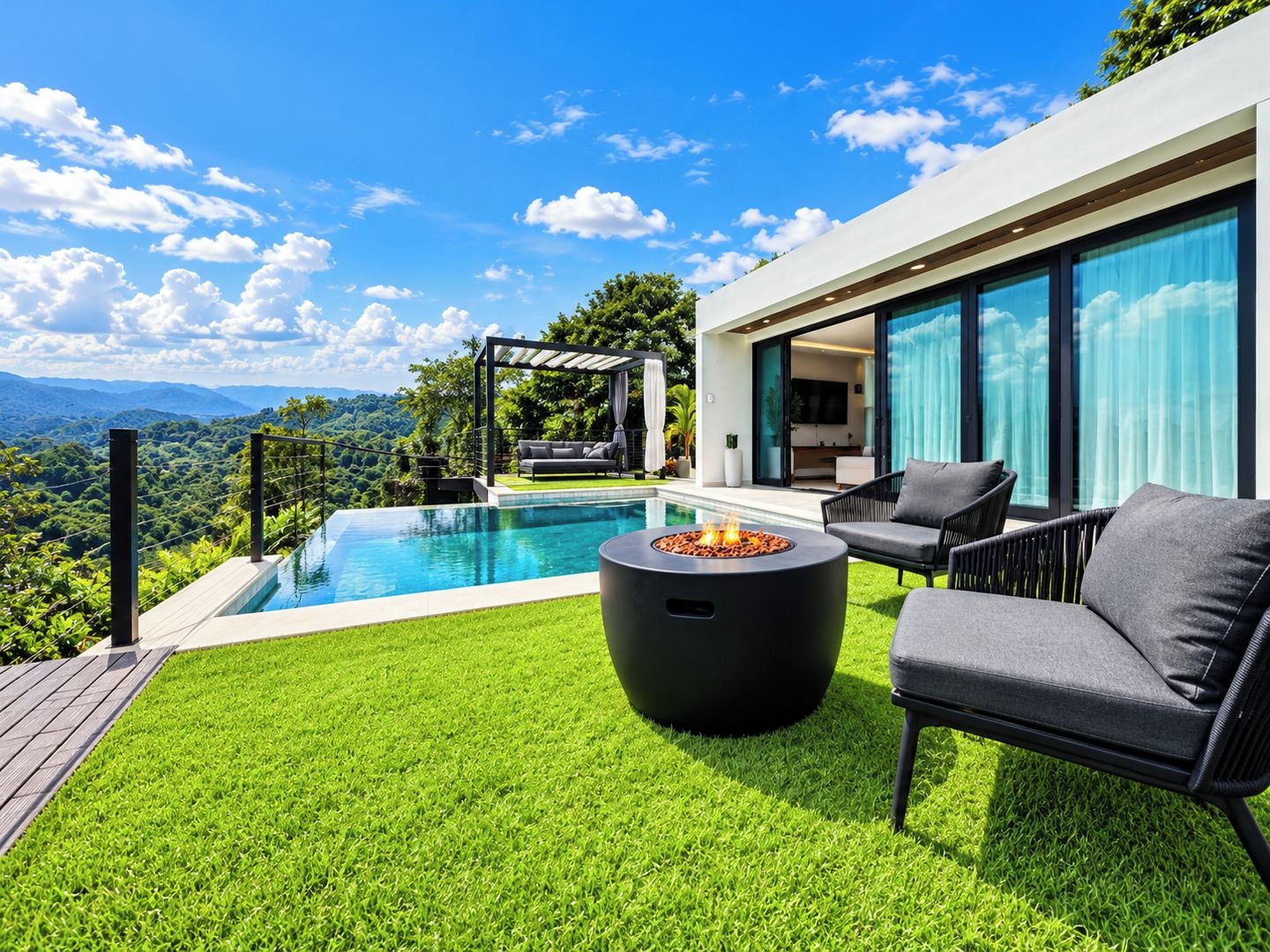 A modern outdoor pool area with a fire pit, seating, and a view of the mountains.