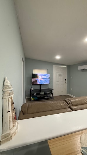 Smart TV, books - Penguins on the Beach | 1BR Beach Shack Steps to Beach & Downtown w/pool | Unit C (Cocoa Beach)