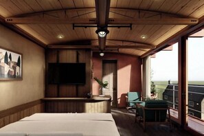 A room with a bed, a TV mounted on the wall, a balcony with a view, and a wooden ceiling. - The Pink Boutique Hotel (Dalat)