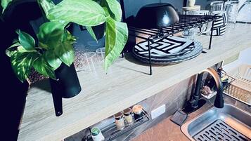 Fridge, stovetop, coffee/tea maker, cookware/dishes/utensils