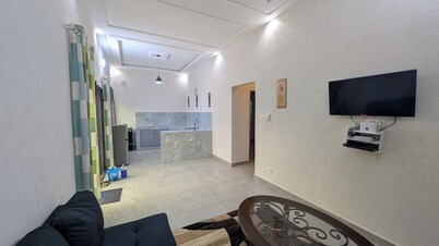 Fabulous 2-bedroom apartment with AC in Abomey Calavi and private backyard