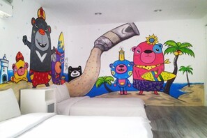 A bedroom with a mural, a bed, and a nightstand. - Mr.Rabbit (Pingtung)
