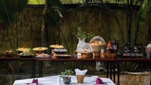 A table set for a meal with various dishes and condiments. - Hoi An Phu Quoc Resort & Spa (Phu Quoc Island)