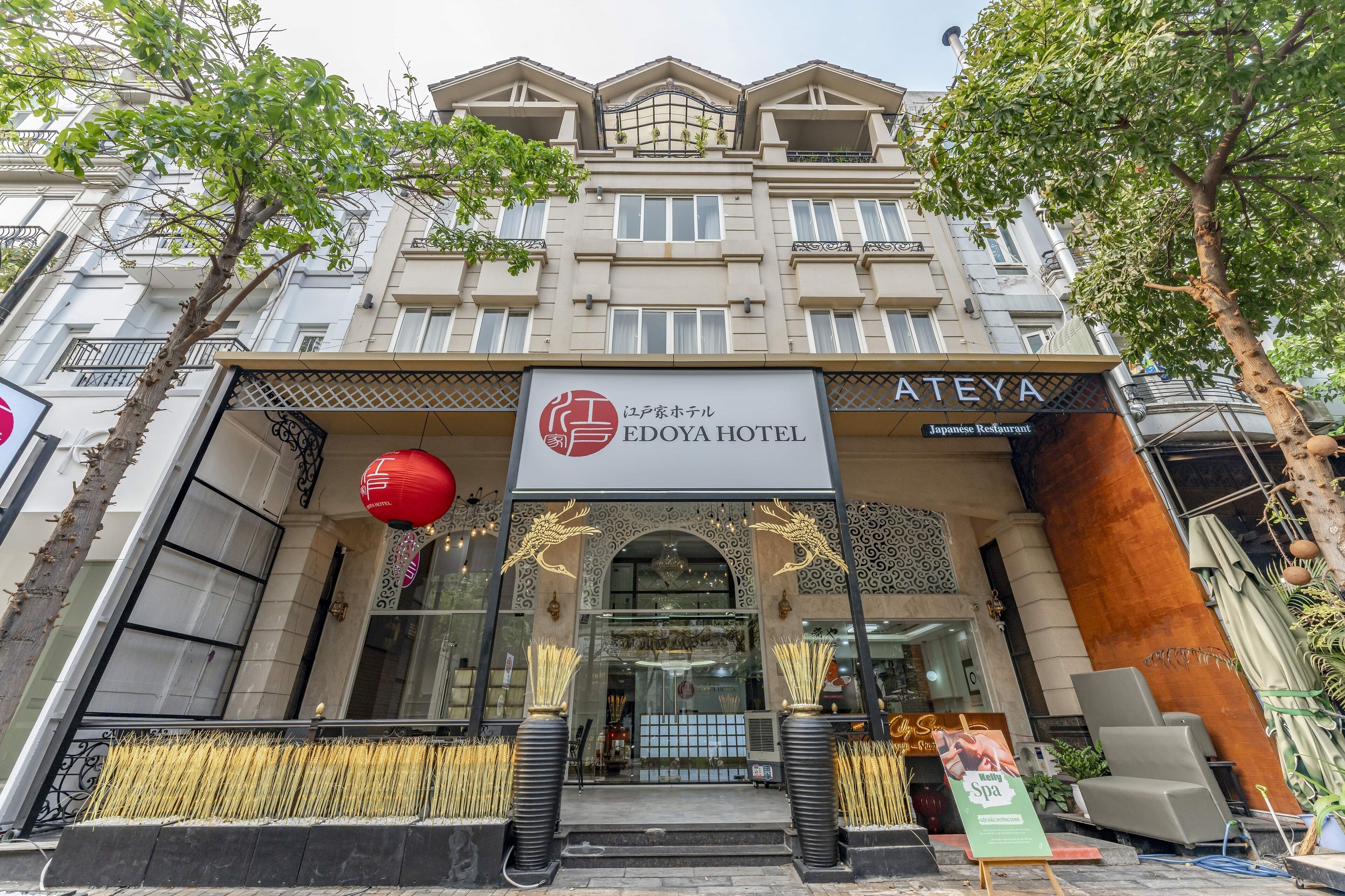 A hotel entrance with a sign for EDOYA HOTEL and a Japanese restaurant.