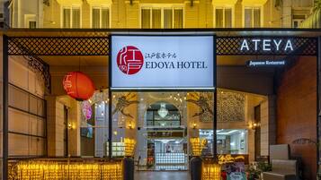 The exterior of EDOYA HOTEL with a sign indicating it is a Japanese Restaurant.