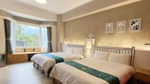 A hotel room with two beds, a window with curtains, a desk, and a wall with three framed pictures. - The M Village (Nantou)
