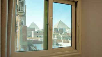 Deluxe Quadruple Room, Mountain View | Free minibar items, individually decorated, individually furnished