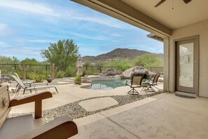 A pool area with lounge chairs, a hot tub, and a view of a mountain. - Mtn-View Patio Oasis! Luxe Family Home in Peoria (Peoria)