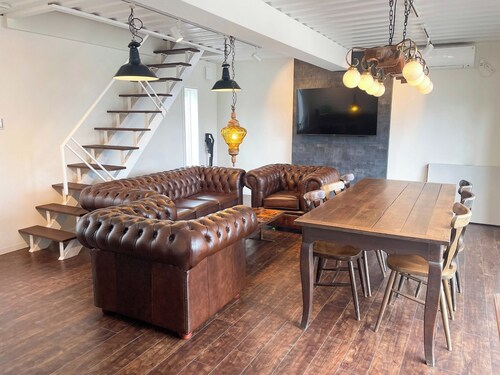 Container Villa A with a sea view accommodates up to 8 people / Oshimagun Kagoshima