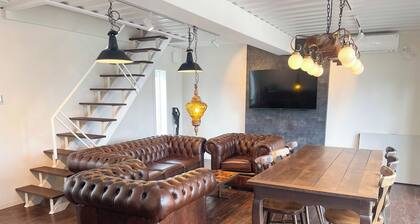 Container Villa A with a sea view accommodates up to 8 people / Oshimagun Kagoshima