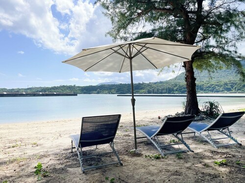 Container Villa B with a sea view accommodates up to 8 people / Oshimagun Kagoshima