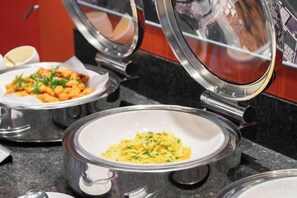 A buffet setup with covered food containers. - Fullon Poshtel Penghu (Penghu)