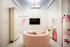 A room with a bed, a wardrobe, a television, a mirror, and a chandelier. - Chunmanxiaozhu (Miaoli)