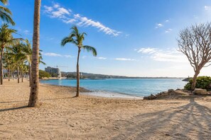 A beach with palm trees, a sandy shore, and a calm sea. - Family 3BR Villa w 2 Pools & Beach Club (14K) (Cruz de Huanacaxtle)