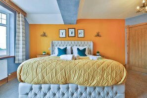 A bedroom with a large bed, a window with curtains, and a view of the outdoors. - The Swansea Homestay Spacious 4-bed Retreat (Swansea)