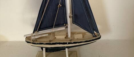 A model sailboat on a stand.