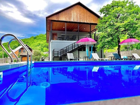 Seasonal outdoor pool, pool umbrellas, sun loungers